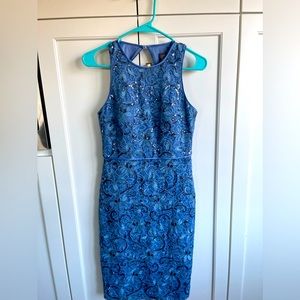 Beautiful sequenced lace dress with round neck line and sexy cut out on back